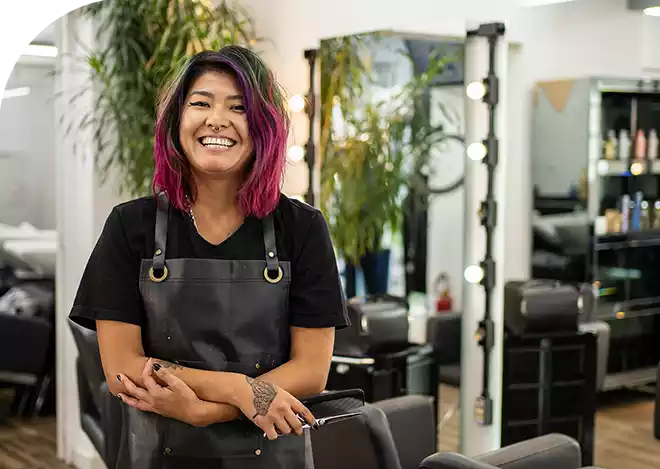 Salon employee smiling